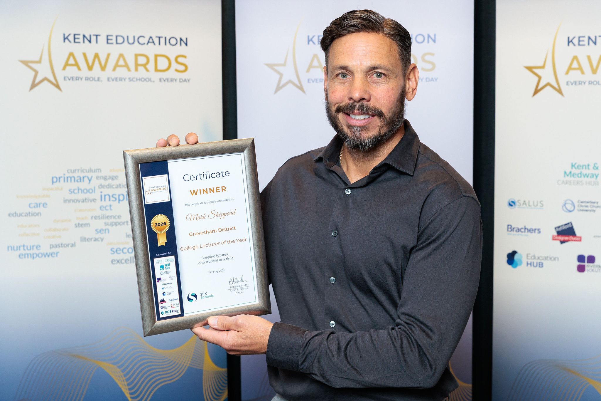 Lecturer holding certificate