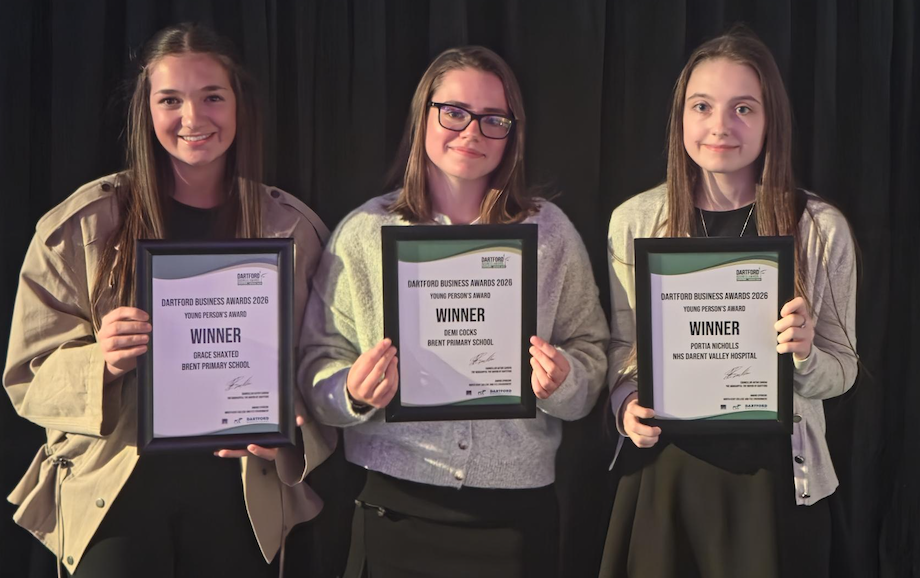 Three college students hold up their Dartford Business Awards certificates