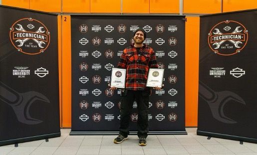 Dean holding Harley Davidson award