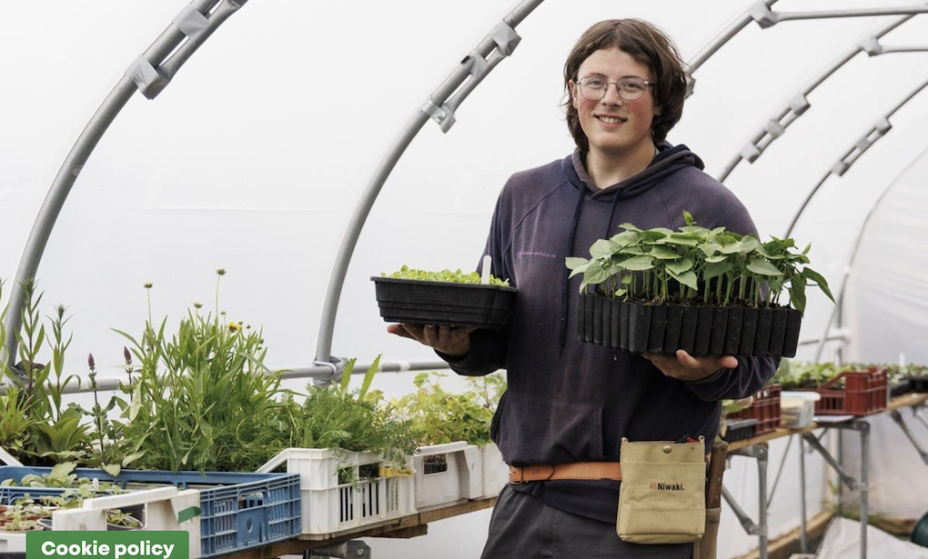 Student holding plants