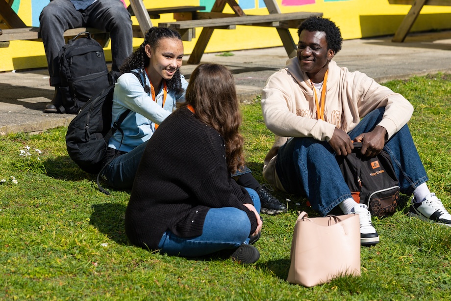 Students sitting on grass