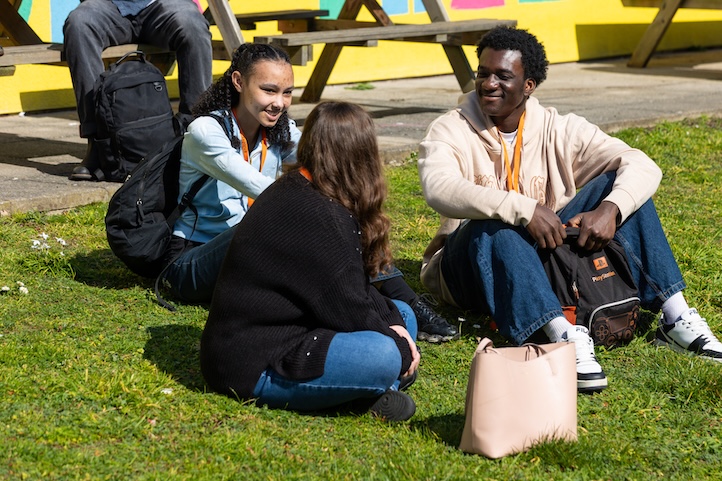 Students sitting on grass